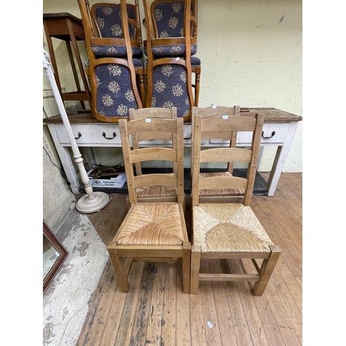 2000 - A modern light oak kitchen table, 153 x 92 cm, six pine ladder back dining chairs, a set of four uph... 