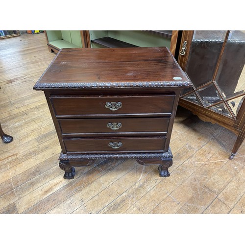 1975 - A brass bound teak trunk, with a later lock, 92 cm wide, a corner cabinet and a bedside chest with t... 