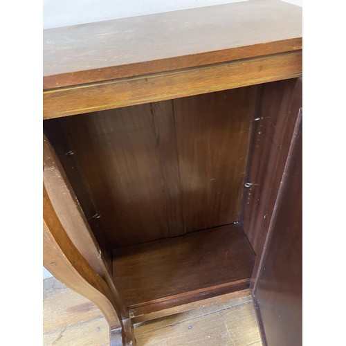 1983 - A mahogany pier cabinet, 61 cm wide