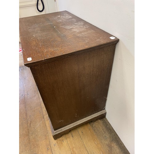 1964 - An oak chest, having two short and three long drawers, 96 cm wide