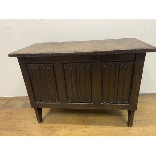 1980 - An oak coffer, 74 cm wide, a nest of three marble top tables, a hall chair, a glass top demi-lune ta... 