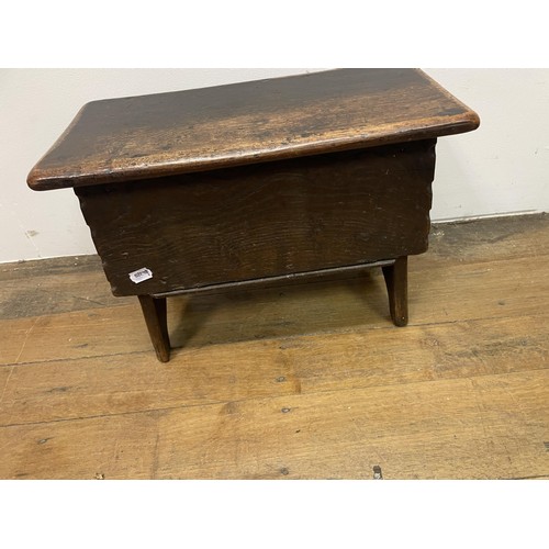 1980 - An oak coffer, 74 cm wide, a nest of three marble top tables, a hall chair, a glass top demi-lune ta... 