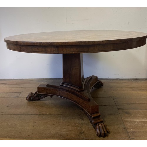 1938 - An early 19th century burr yew centre table, in the manner of George Bullock, the top with ebony str... 