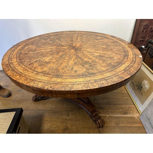 1938 - An early 19th century burr yew centre table, in the manner of George Bullock, the top with ebony str... 