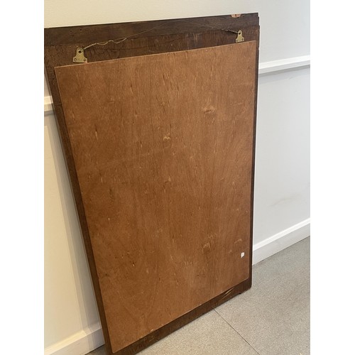 1948 - An Art Deco wall mirror, in a walnut frame, 123 x 75 cm