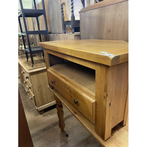 1957 - A pine kitchen table, 168 cm wide, a TV stand, a chest of three drawers, a side cabinet, a stool, a ... 