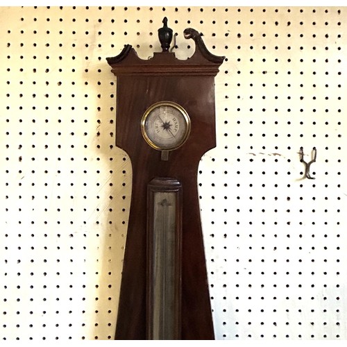 1999A - A wheel barometer, in a mahogany case, 110 cm high and a mahogany wine table, on a tripod base, 50 c... 