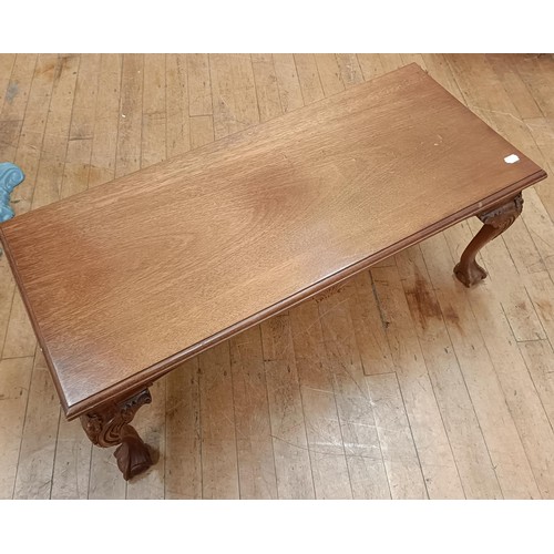 1998A - A mahogany low table, on carved cabriole legs with claw and ball feet, 107 cm wide and a painted sid... 