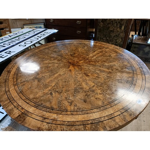 1938 - An early 19th century burr yew centre table, in the manner of George Bullock, the top with ebony str... 