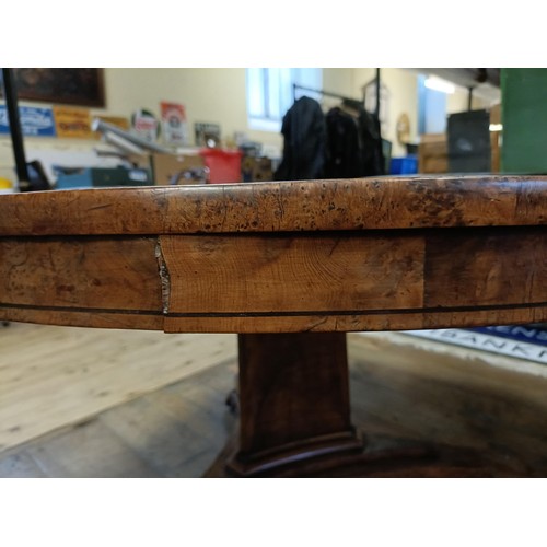 1938 - An early 19th century burr yew centre table, in the manner of George Bullock, the top with ebony str... 