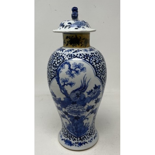 926 - A Chinese blue and white vase and cover, decorated bird and foliage, four character mark to base, 30... 