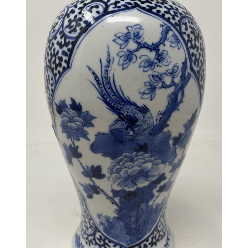 926 - A Chinese blue and white vase and cover, decorated bird and foliage, four character mark to base, 30... 