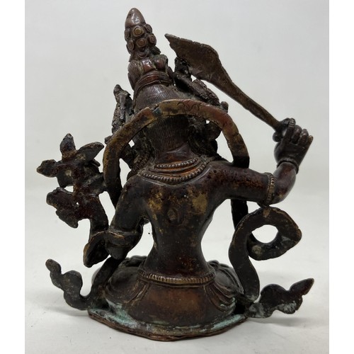 1044 - A bronze Buddha, 10 cm high