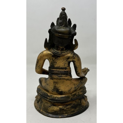 1045 - A gilt bronze Buddha, 15 cm high