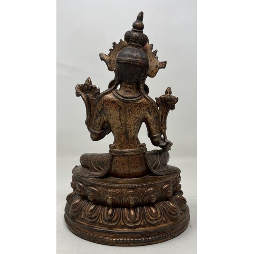 947 - A gilt bronze Buddha, 22 cm high