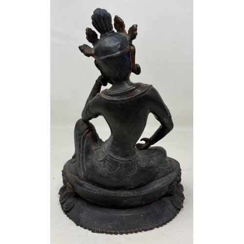 941 - A bronze Buddha, 21 cm high