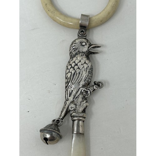 4 - ***Withdrawn*** A silver and mother of pearl baby's rattle, in the form of a bird, Birmingham 1925, ... 