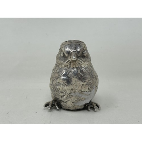 5 - A novelty Continental silver coloured metal pepper, in the form of a chick, import marks for London ... 