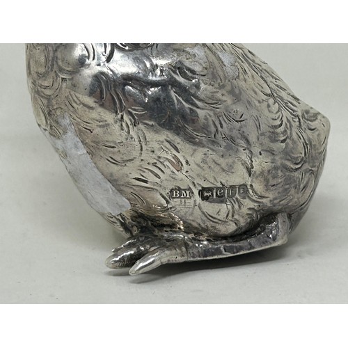 5 - A novelty Continental silver coloured metal pepper, in the form of a chick, import marks for London ... 