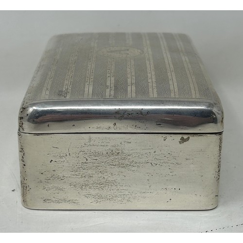 11 - A George V silver table cigarette box, Birmingham 1928, 12 cm wide