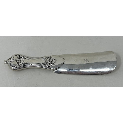 14 - A sterling silver shoe horn, handle filled, 79 g all in