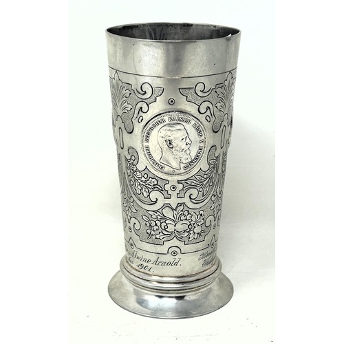 32 - A Continental silver coloured metal beaker, inset with coins, .800