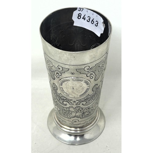 32 - A Continental silver coloured metal beaker, inset with coins, .800