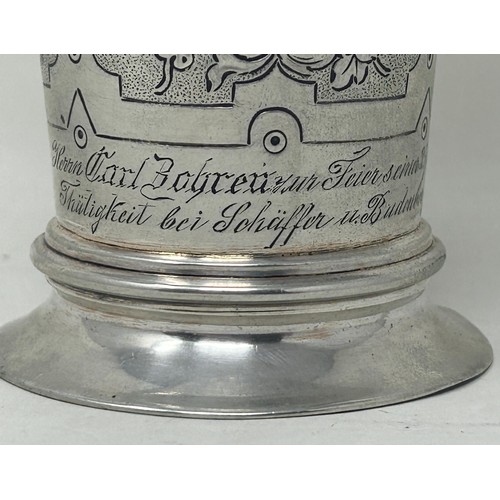 32 - A Continental silver coloured metal beaker, inset with coins, .800