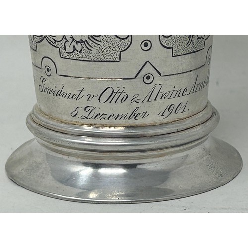 32 - A Continental silver coloured metal beaker, inset with coins, .800