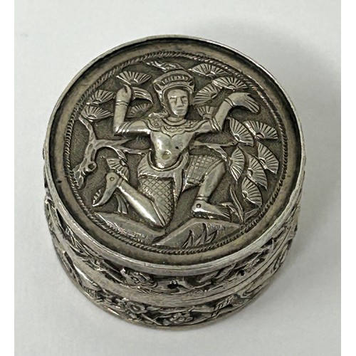 42 - An Indian silver coloured metal pill box, decorated a figure, 19.2 g