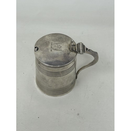 49 - A George III silver mustard, in the form of a tankard, London 1807, 2.3 ozt, and an associated spoon... 