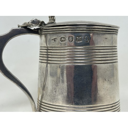 49 - A George III silver mustard, in the form of a tankard, London 1807, 2.3 ozt, and an associated spoon... 