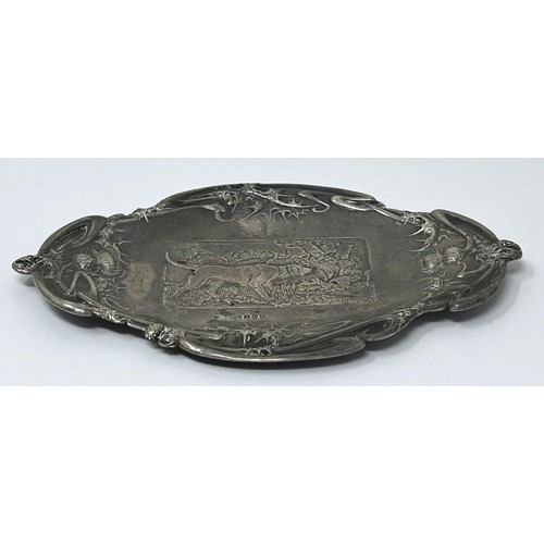 62 - A Edward VII silver dish, decorated hound, import marks for London 1904