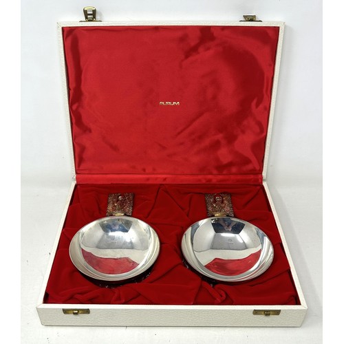 77 - A pair of Elizabeth II silver and silver gilt limited edition wine tasters, Jocelyn Burton, London 1... 