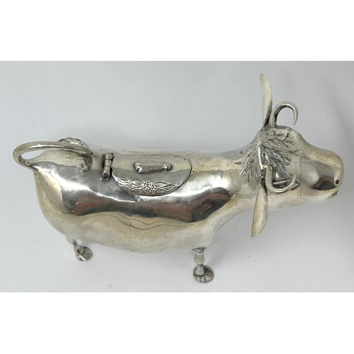 89 - A Continental silver coloured metal novelty creamer, in the form of a cow