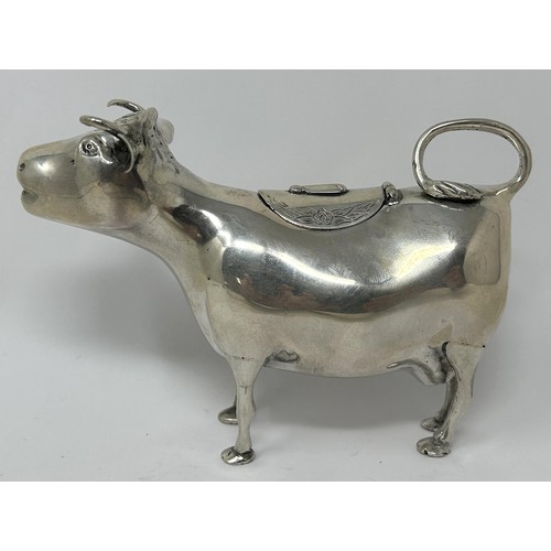 89 - A Continental silver coloured metal novelty creamer, in the form of a cow