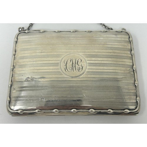 111 - A George V silver purse, with a leather interior, Birmingham 1914, 4.2 ozt all in