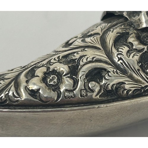 115 - A novelty silver coloured metal pin cushion, in the form of a shoe