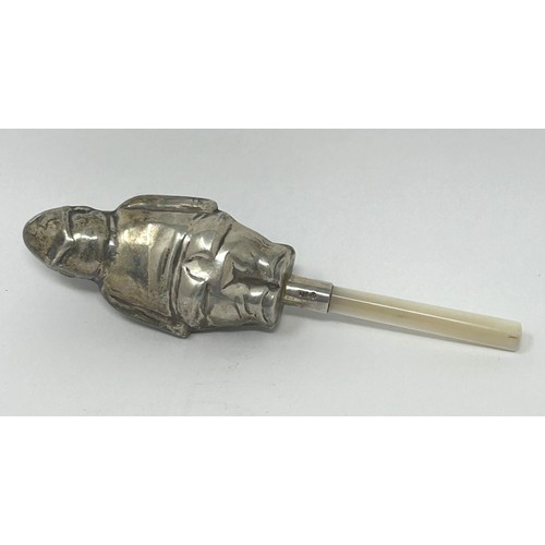 127 - A silver coloured metal and mother of pearl novelty baby's rattle, in the form of a fireman