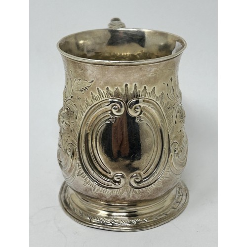 131 - A George III silver mug, marks rubbed, later decorated, 5.1 ozt