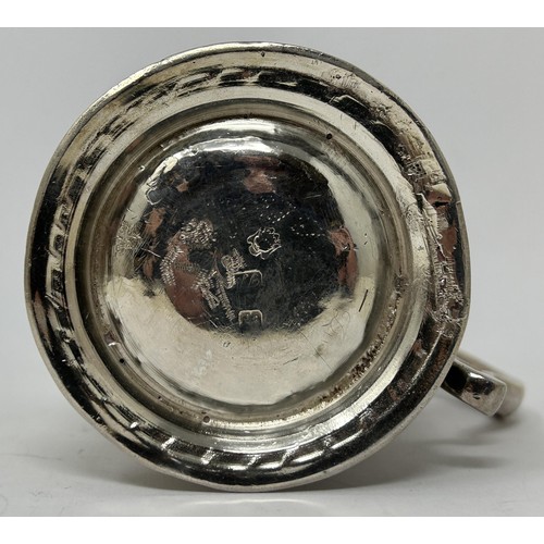 131 - A George III silver mug, marks rubbed, later decorated, 5.1 ozt