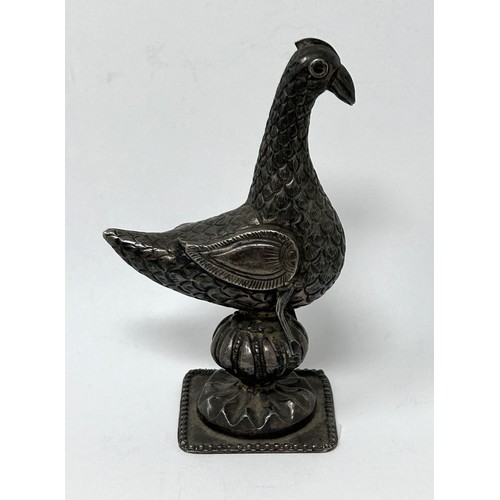 138 - A Persian silver coloured metal mount, in the form of a bird, 10 cm high