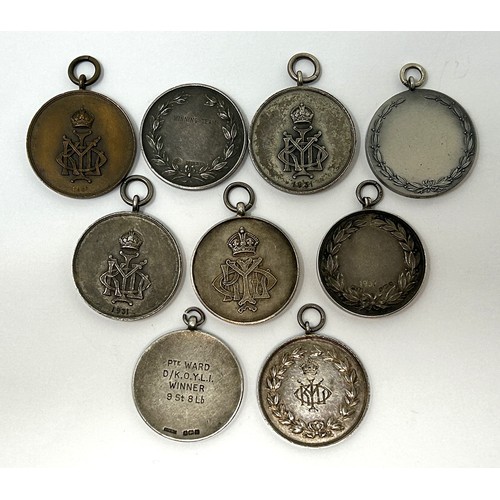 153 - Seven silver sporting medallions, and two others, (9)