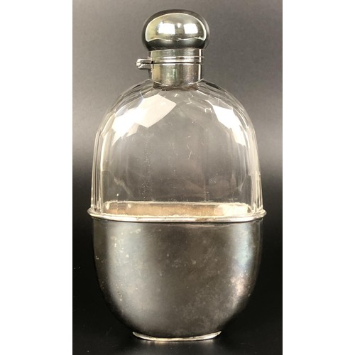 162 - A silver coloured metal and cut glass hip flask