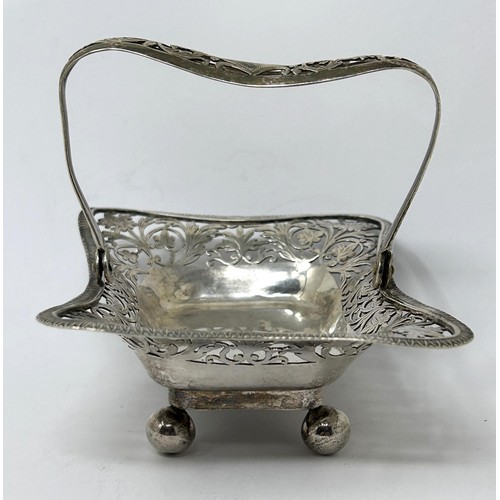 179 - A pierced silver swing handled basket, marks rubbed, 4.4 ozt