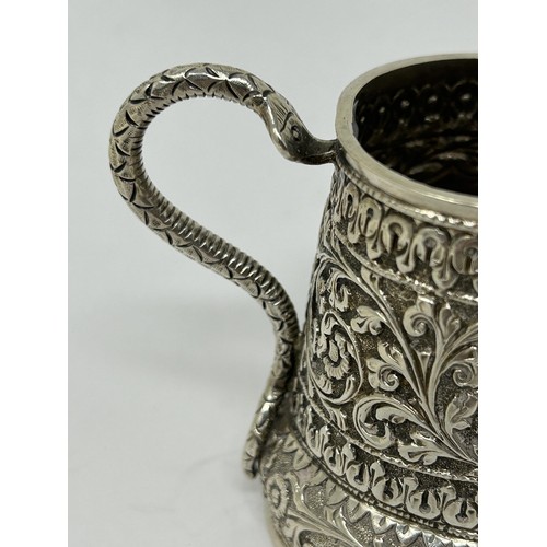 180 - An Indian silver coloured metal cream jug, 3.58 ozt