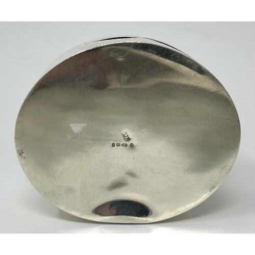 185 - A Continental silver coloured metal oval box, top inset with blue and white ceramic panel