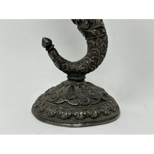 189 - An Indian silver coloured metal posy holder, 14 cm high