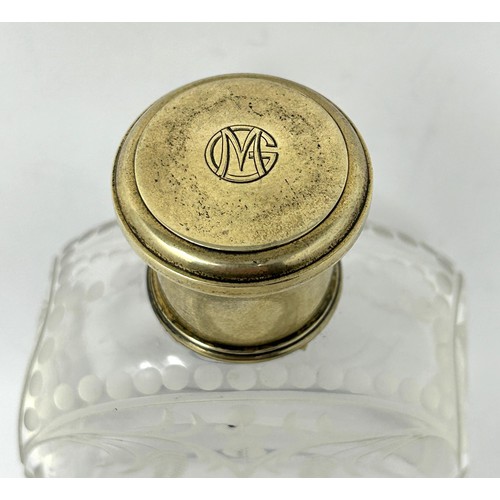 190 - An engraved glass perfume bottle, with gilt metal cap, 12 cm high