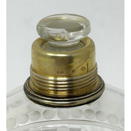 190 - An engraved glass perfume bottle, with gilt metal cap, 12 cm high